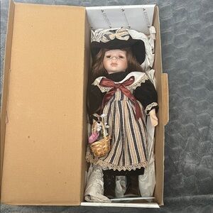 King state Porcelain Doll in Striped Dress with Hat